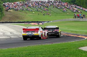 Paul Menard's Chevy Camaro and Ryan Blaney's Ford Mustang