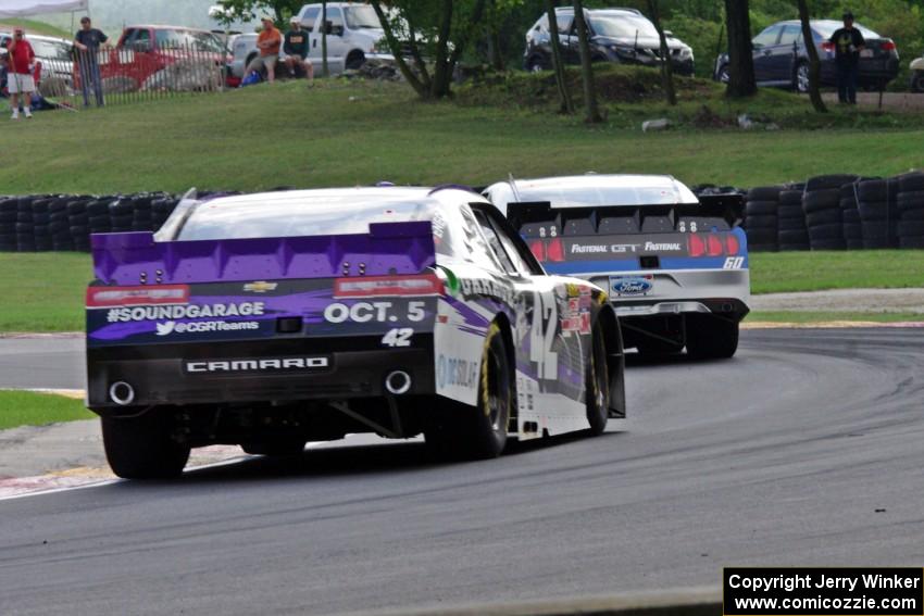 Justin Marks' Chevy Camaro chases Chris Buescher's Ford Mustang