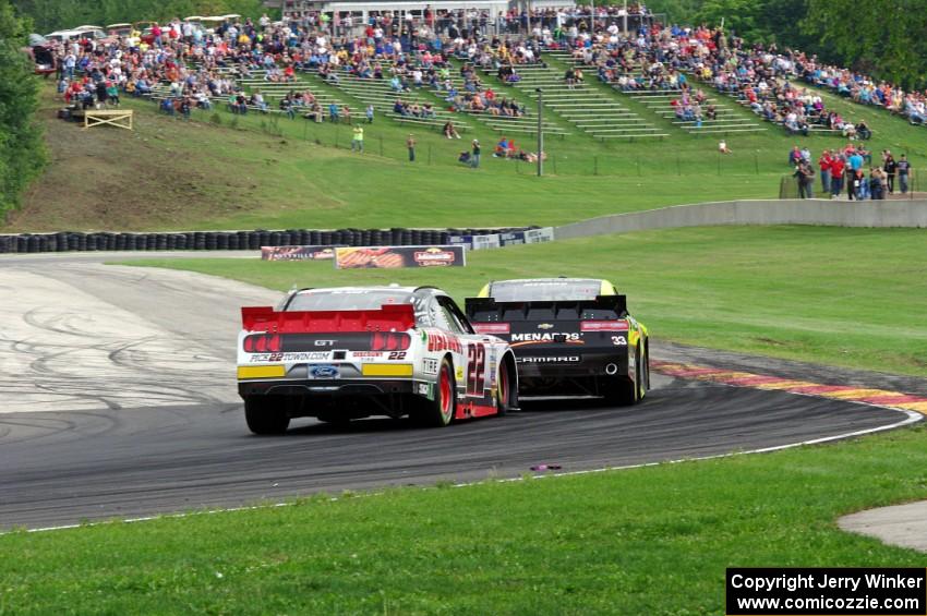 Paul Menard's Chevy Camaro and Ryan Blaney's Ford Mustang