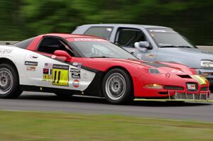 Darrell Peterson's SPO Chevy Corvette passes Glen Wilson's ITS VW GTI
