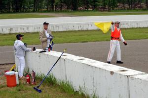 Bob Brist waves the yellow flag at turn 13.