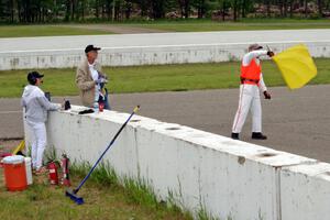 Bob Brist waves the yellow flag at turn 13.