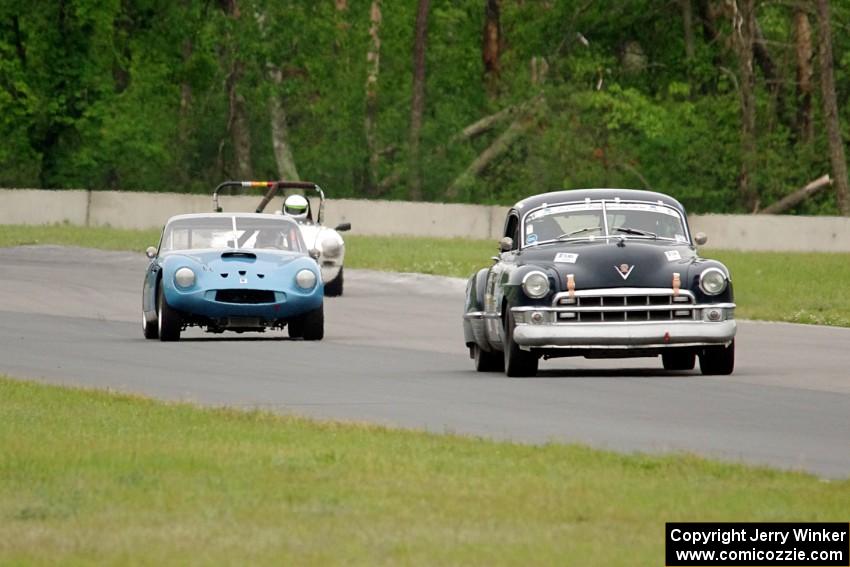 John Daniels, Jr.'s Cadillac Sedanette, John Hagen's TVR Griffith and Steve Nichols' MGB