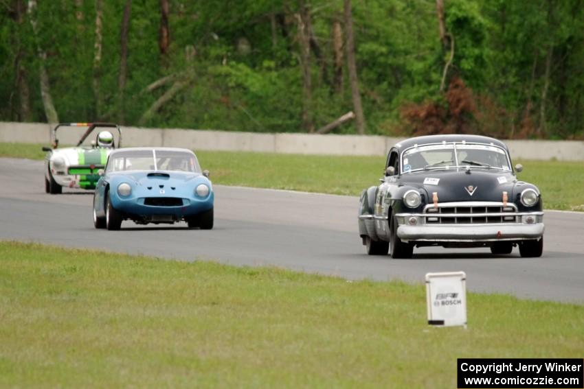 John Daniels, Jr.'s Cadillac Sedanette, John Hagen's TVR Griffith and Steve Nichols' MGB