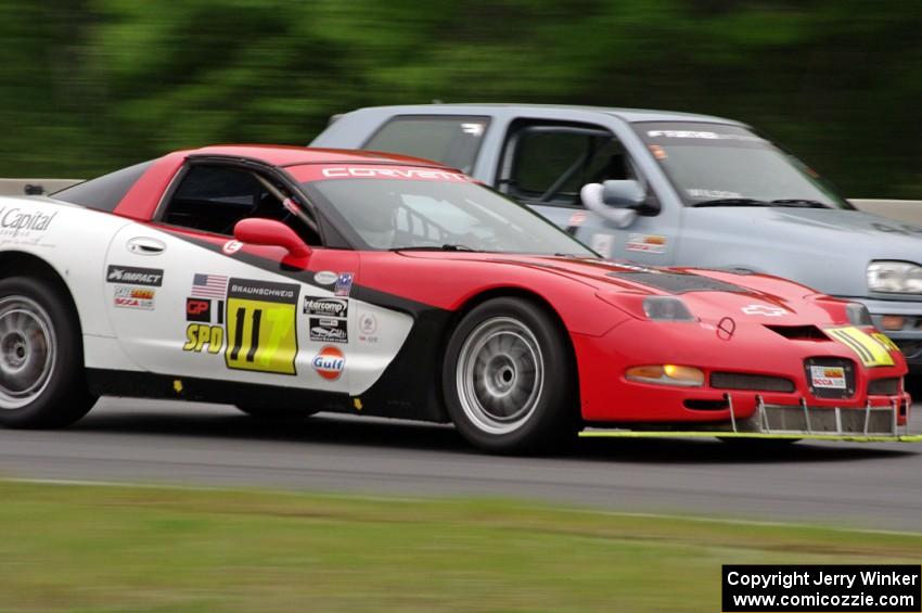 Darrell Peterson's SPO Chevy Corvette passes Glen Wilson's ITS VW GTI