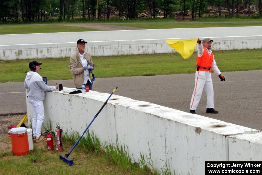 Bob Brist waves the yellow flag at turn 13.