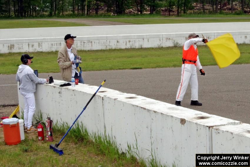 Bob Brist waves the yellow flag at turn 13.