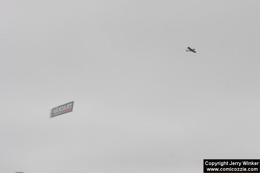 Airplane with Tracker advertisement flying over the track.