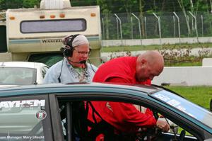 Mary Utecht helps Mark Utecht into his STL Honda Civic