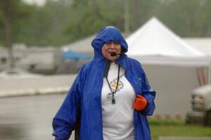 Karen Carson works the false grid while trying to keep dry in the pouring rain.