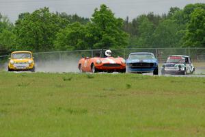 Rich Stadther's Elva Courier, Ken Hilash's Austin Mini-Cooper, Brian Kennedy's Ford Mustang and Dyrk Bolger's Austin Mini-Cooper