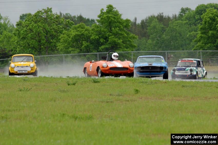 Rich Stadther's Elva Courier, Ken Hilash's Austin Mini-Cooper, Brian Kennedy's Ford Mustang and Dyrk Bolger's Austin Mini-Cooper