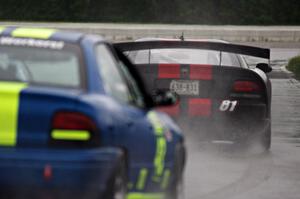 Keith Anderson's GT-1 Dodge Viper leads John Glowaski's ITA Dodge Neon ACR