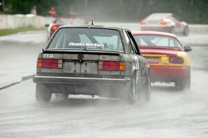 Austin Hallberg's ITA BMW 328 chases Greg Youngdahl's ITA Mazda Miata