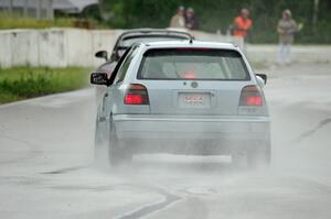 Glen Wilson's ITS VW GTI chases Phil Magney's ITE-1 Porsche 993