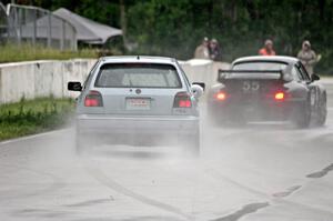 Glen Wilson's ITS VW GTI chases Phil Magney's ITE-1 Porsche 993