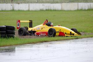 Steve Thomson's Van Diemen RF02/Zetec Formula Atlantic is stuck after going off at turn 12.