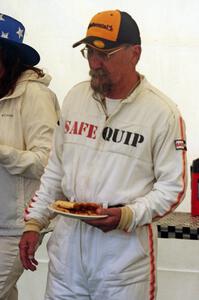 Bob Brist grabs a couple of slices of pizza.