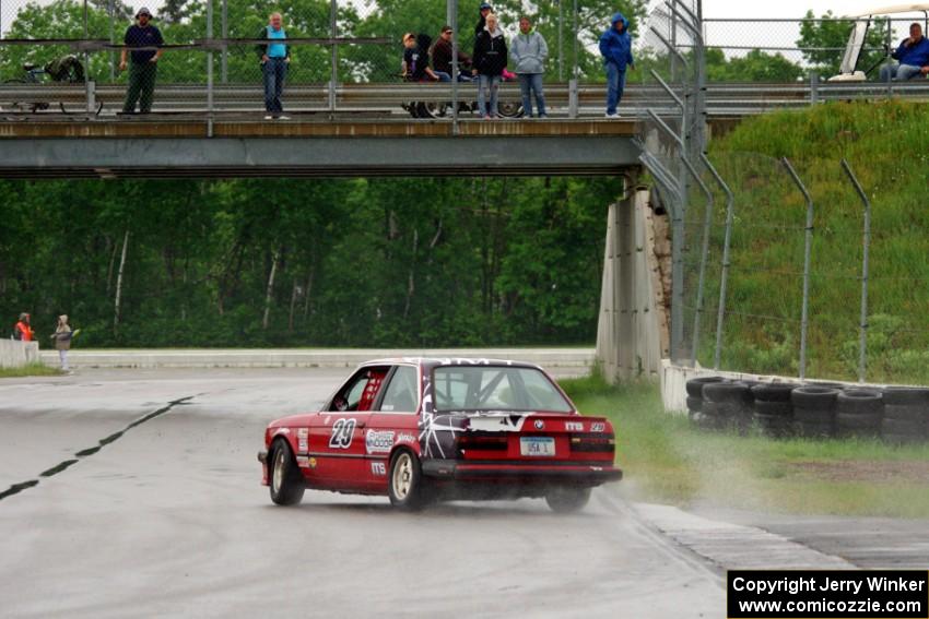 Mike Campbell's ITS BMW 325is gets loose out of turn 12.