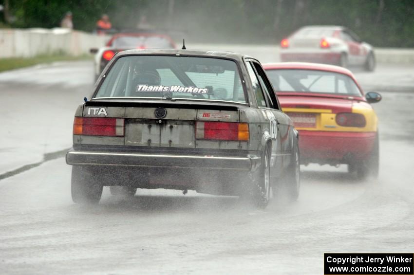 Austin Hallberg's ITA BMW 328 chases Greg Youngdahl's ITA Mazda Miata