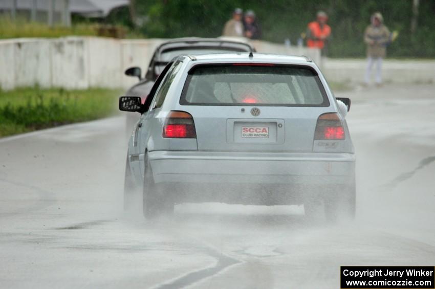 Glen Wilson's ITS VW GTI chases Phil Magney's ITE-1 Porsche 993