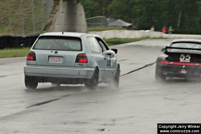 Glen Wilson's ITS VW GTI chases Phil Magney's ITE-1 Porsche 993