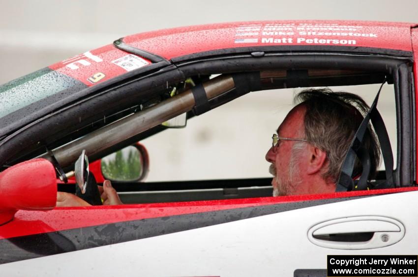 Darrell Peterson sits in his SPO Chevy Corvette