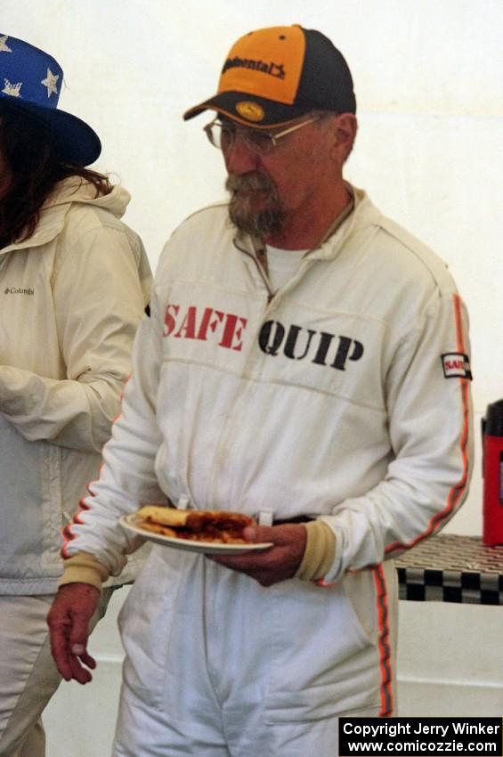 Bob Brist grabs a couple of slices of pizza.