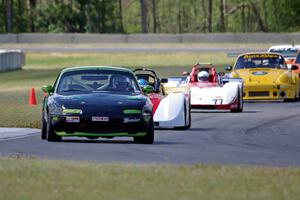 Aaron Jongbloedt's PTE Mazda Miata leads the pack into turn 4.