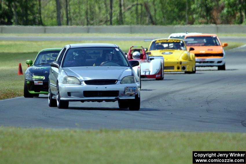 Nicholas Anderson's HPD Honda Civic leads the pack into turn 4.