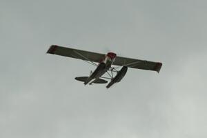 A floatplane flies over turn 2 during the race.