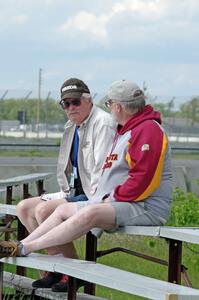 Zane Emstad and Don Haaversen watch the races from the bleachers at turn 3.