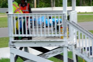 Brian Kennedy's Ford Mustang Boss 302 past the turn 1A flagstand.