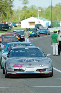 Bill Collins' T2 Chevy Corvette at the front of the grid for Race Group 5.