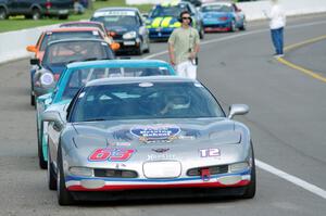 Bill Collins' T2 Chevy Corvette at the front of the grid for Race Group 5.