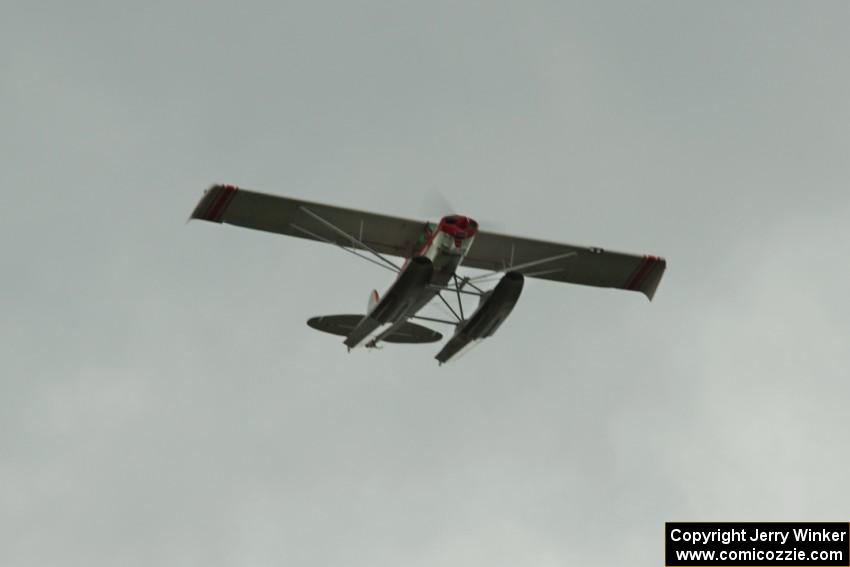 A floatplane flies over turn 2 during the race.