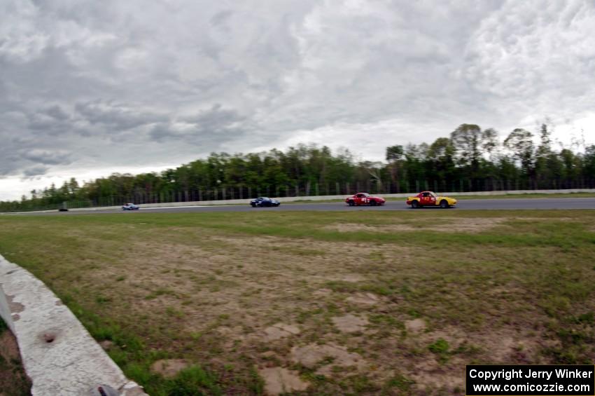 Greg Youngdahl's, Andrew Jenkins', Craig Silver's and Rick Buan's Spec Miata Mazda Miatas