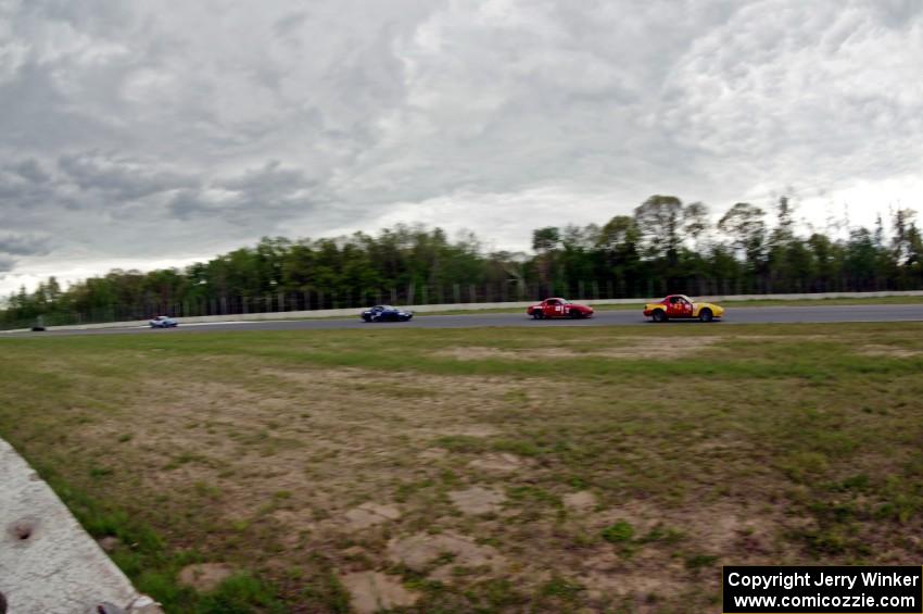 Greg Youngdahl's, Andrew Jenkins', Craig Silver's and Rick Buan's Spec Miata Mazda Miatas