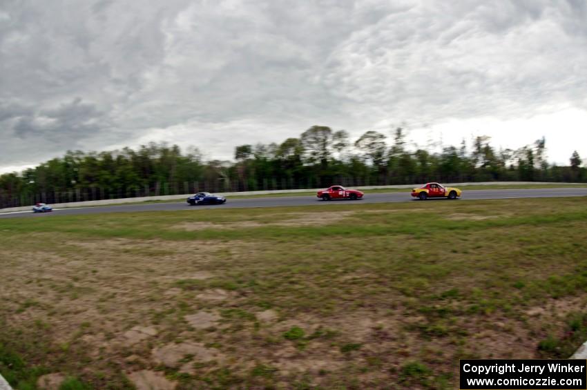 Greg Youngdahl's, Andrew Jenkins', Craig Silver's and Rick Buan's Spec Miata Mazda Miatas