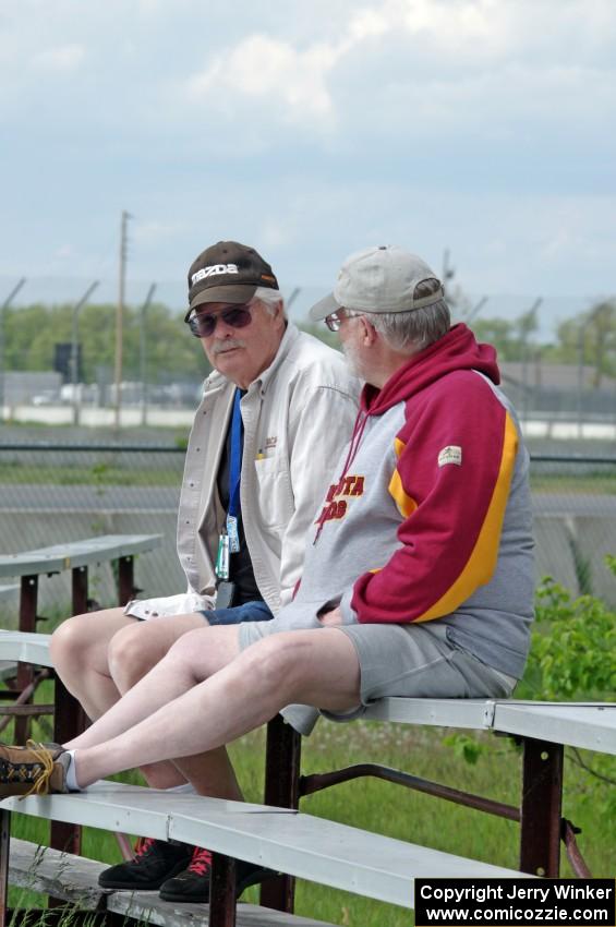 Zane Emstad and Don Haaversen watch the races from the bleachers at turn 3.