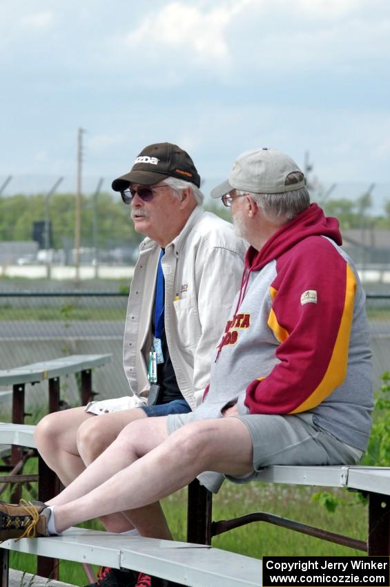 Zane Emstad and Don Haaversen watch the races from the bleachers at turn 3.