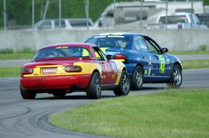 John Glowaski's ITA Dodge Neon ACR and Greg Youngdahl's ITA Mazda Miata
