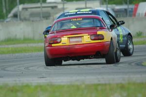 Greg Youngdahl's ITA Mazda Miata chases John Glowaski's ITA Dodge Neon ACR