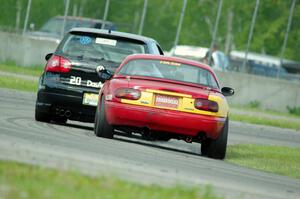 Greg Youngdahl's ITA Mazda Miata chases Tom Daly's STU VW Rabbit