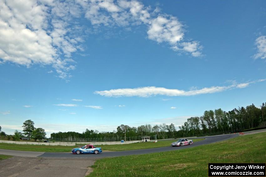 Rick Buan's STU Mazda Miata and Bill Collins' T2 Chevy Corvette