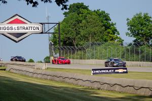 Derek DeBoer's Aston Martin Vantage GT4, Jade Buford's SIN R1 GT4 and Scott Dollahite's Lotus Evora