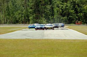 First lap: Lawrence Loshak's Chevy Camaro passes Tony Buffomante's Ford Mustang for the lead out of turn 3 into turn 4.