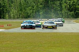 First lap: Lawrence Loshak's Chevy Camaro passes Tony Buffomante's Ford Mustang for the lead out of turn 3 into turn 4.