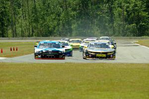 First lap: Lawrence Loshak's Chevy Camaro passes Tony Buffomante's Ford Mustang for the lead out of turn 3 into turn 4.