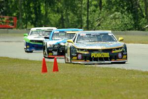 Lawrence Loshak's Chevy Camaro, Tony Buffomante's Ford Mustang and Gar Robinson's Chevy Camaro